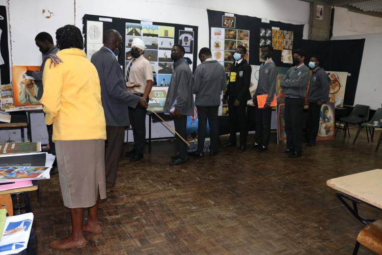 Mr. Ouma from Stad makes a presentation of the Design exhibition to students  from St Mary's School Nairobi